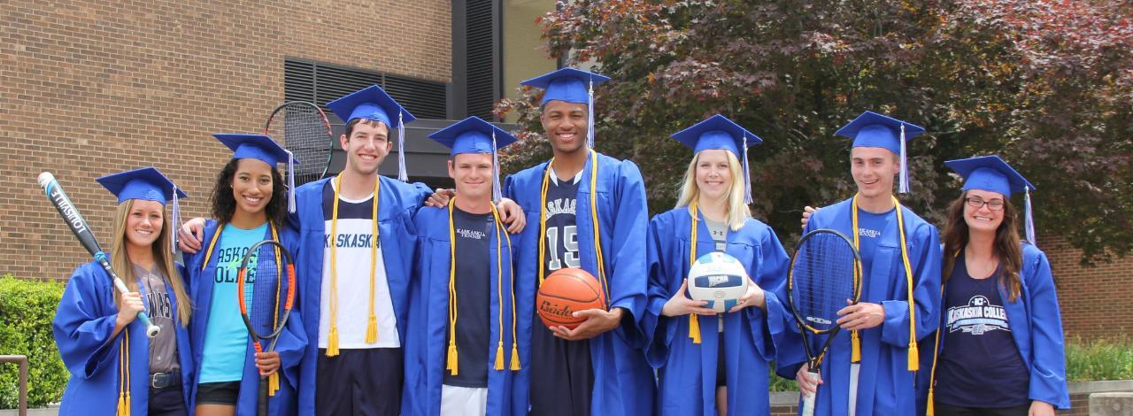 KC athletes representing their respective sports while wearing their graduation caps and gowns.